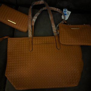 This is a Time and Tru Tote, Wristlet-Pouch Crossbody, and Zip-Around Wallet set